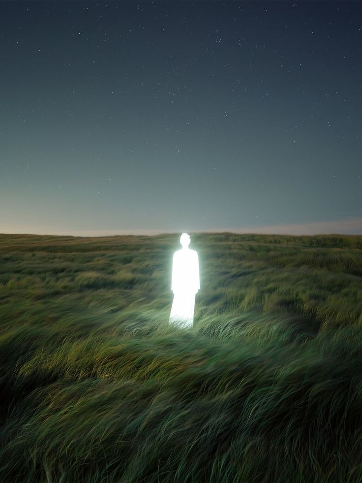Glowing figure in field